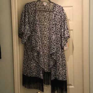 Black and white patterned coverup w black fringe.